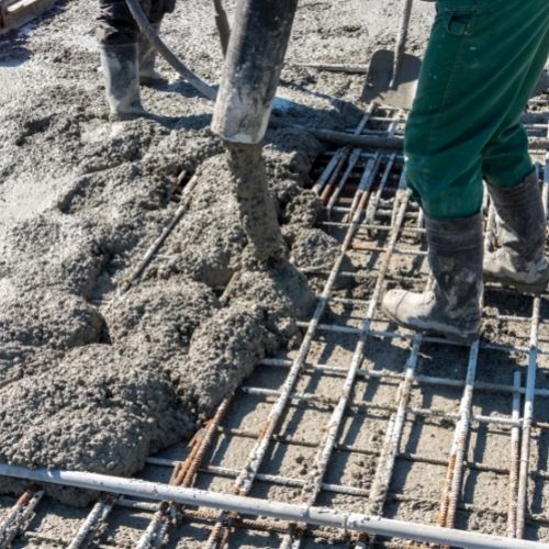 men pouring concrete