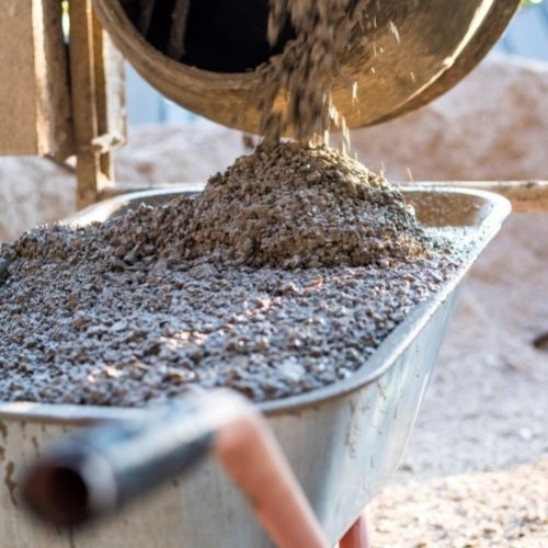 pouring concrete into cart